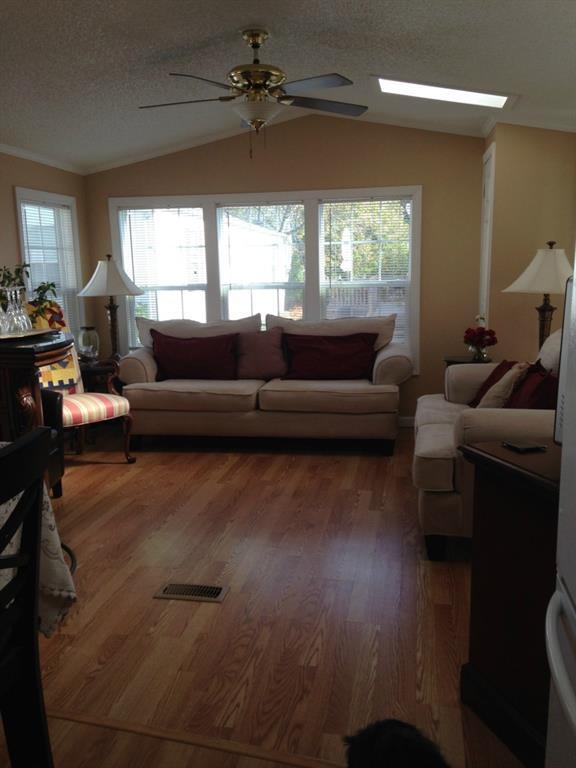62 Fort Hill Road Groton, CT 06340 - Photo 1 of 1 This living room has a sofa that is 84 " in length and a love seat that is 64" in length plus two chairs, a bar with bar stools, two end tables and a TV table. The sliders are on one wall and the other two walls have three windows each. Great cross breezes in the summer especially with the ceiling fan.