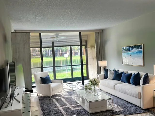 a front view of residential houses with yard