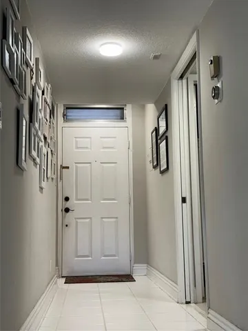 a kitchen with a refrigerator a sink and a stove top oven