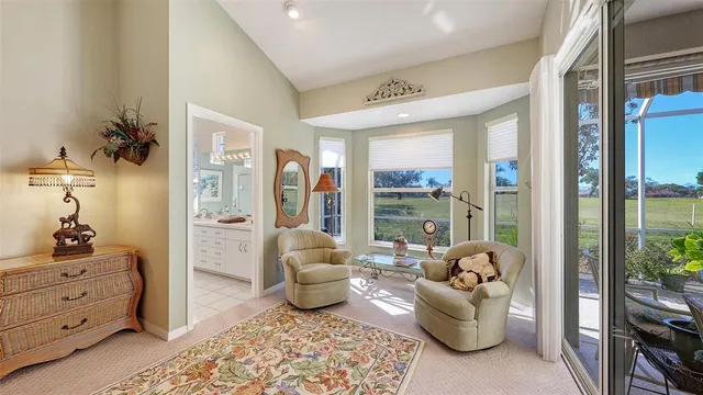 a view of a patio with a table chairs and a potted plant