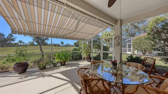a view of a backyard with a tree