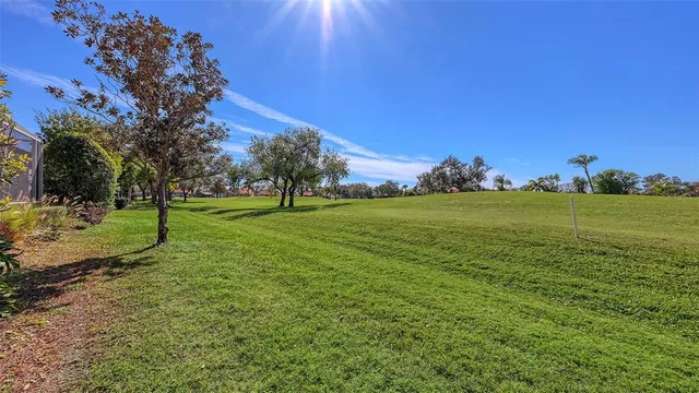 a view of a patio with a table and chairs under an umbrella