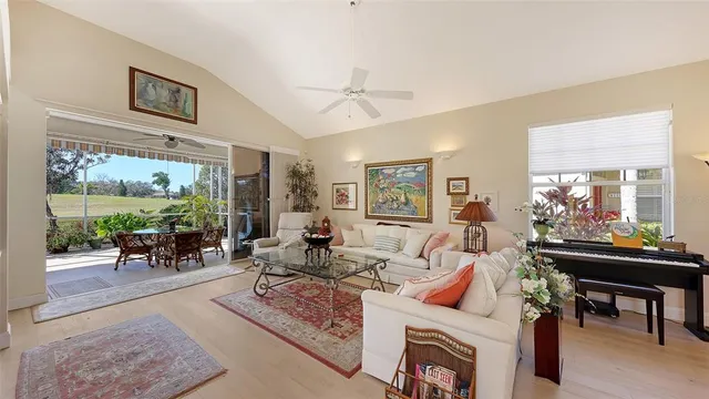 a living room with furniture a fireplace and a table