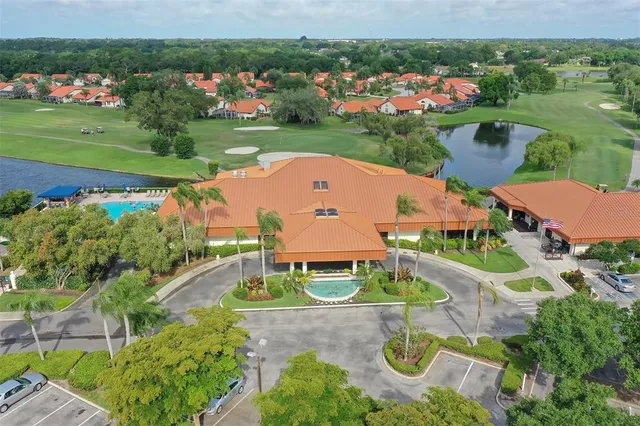 a living room with lots of furniture and a floor to ceiling window