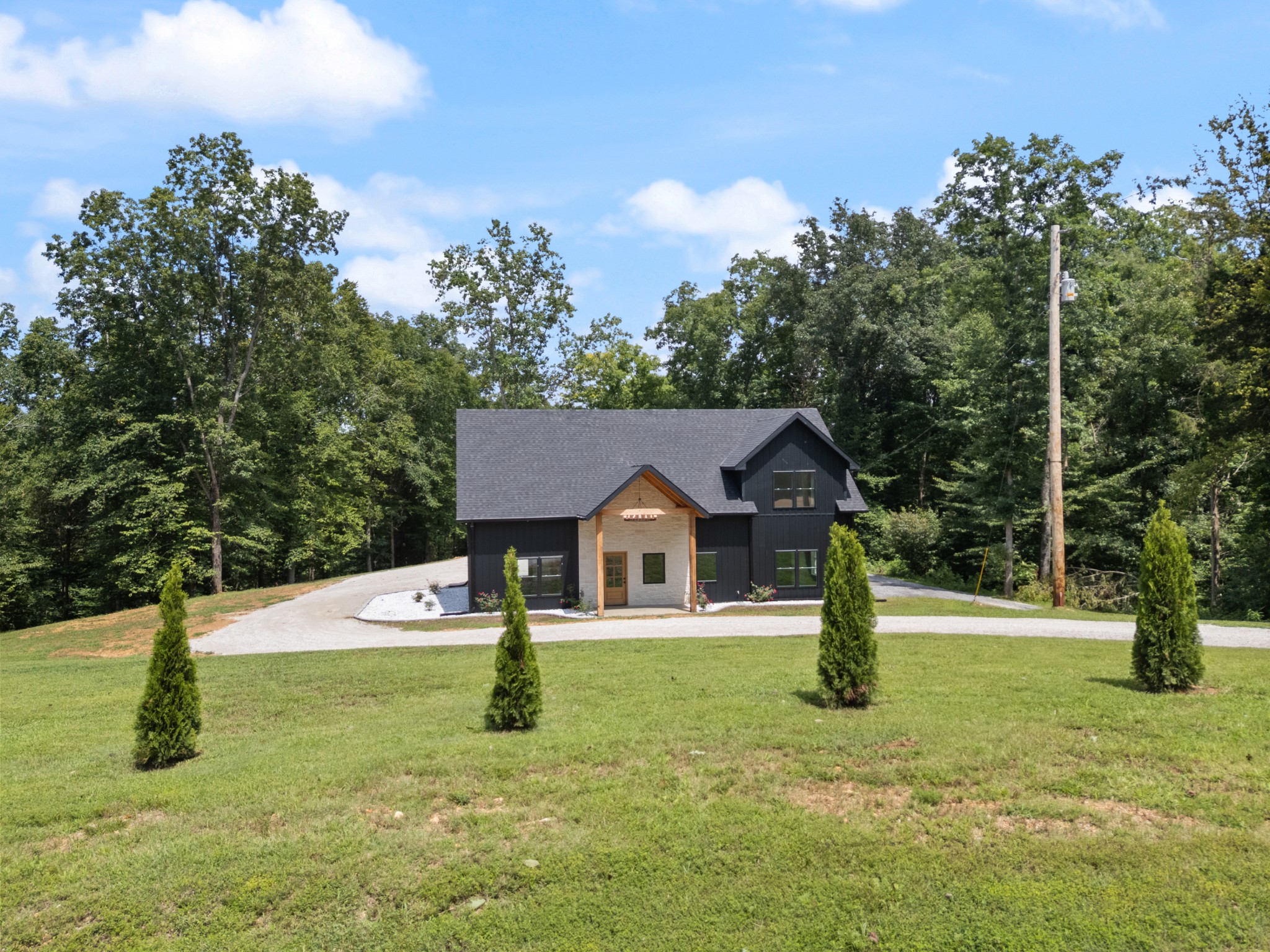 7922 East Plunders Creek Road Dickson, TN 37055 - Photo 4 of 86 a house with green field in front of it