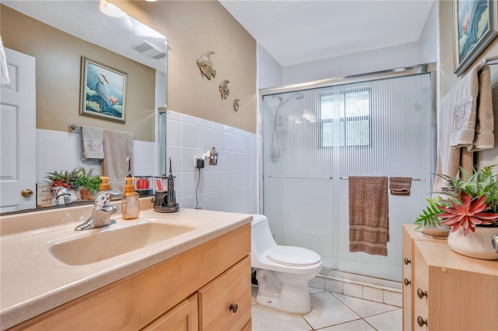 2067 Lake Juanita Road Seville, FL 32190 - Photo 25 of 96 a bathroom with a sink toilet and shower