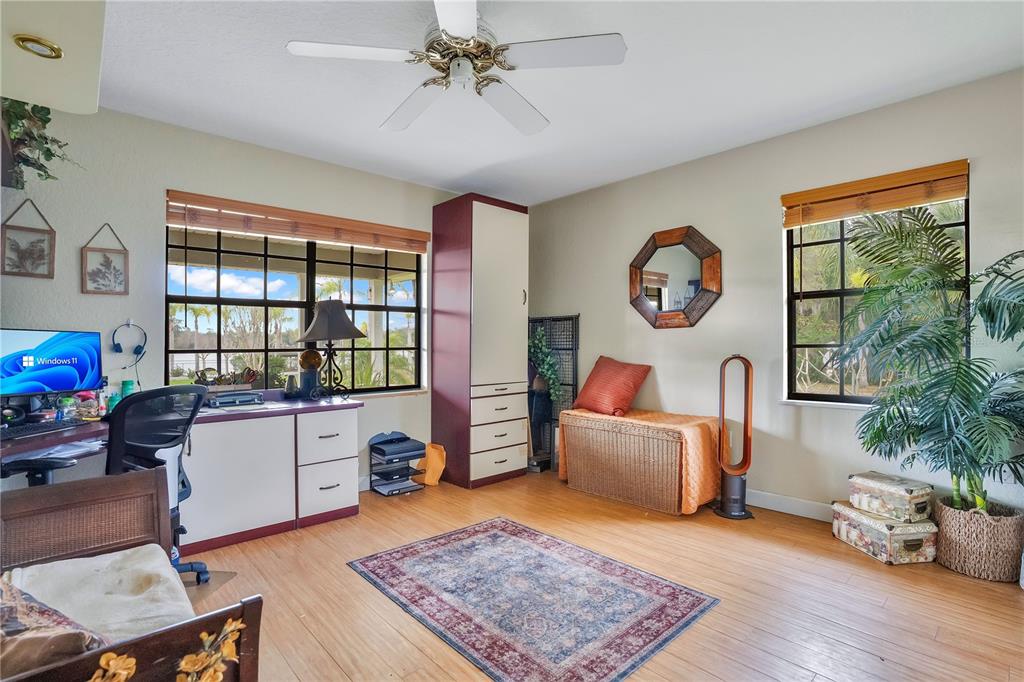 2067 Lake Juanita Road Seville, FL 32190 - Photo 26 of 96 a living room with furniture and a window