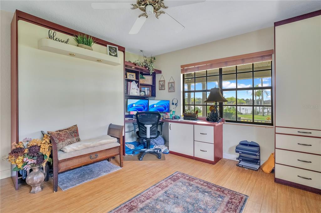 2067 Lake Juanita Road Seville, FL 32190 - Photo 27 of 96 a living room with furniture and a wooden floor