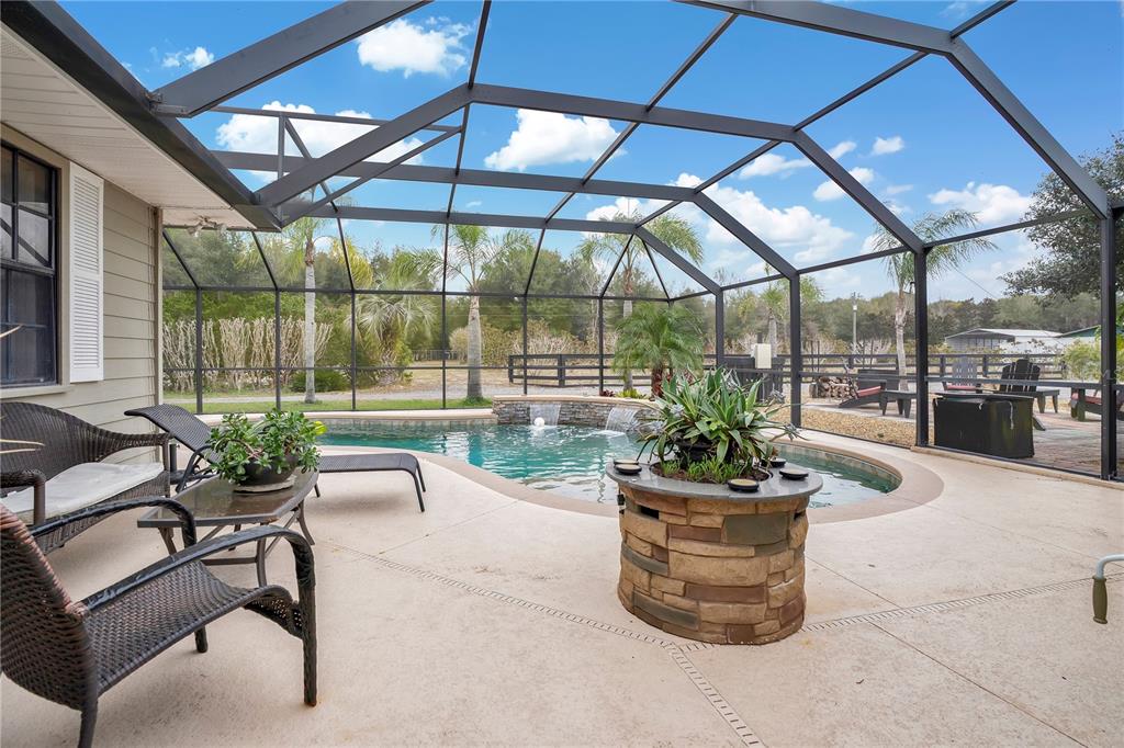 2067 Lake Juanita Road Seville, FL 32190 - Photo 31 of 96 a view of a patio with a dining table and chairs