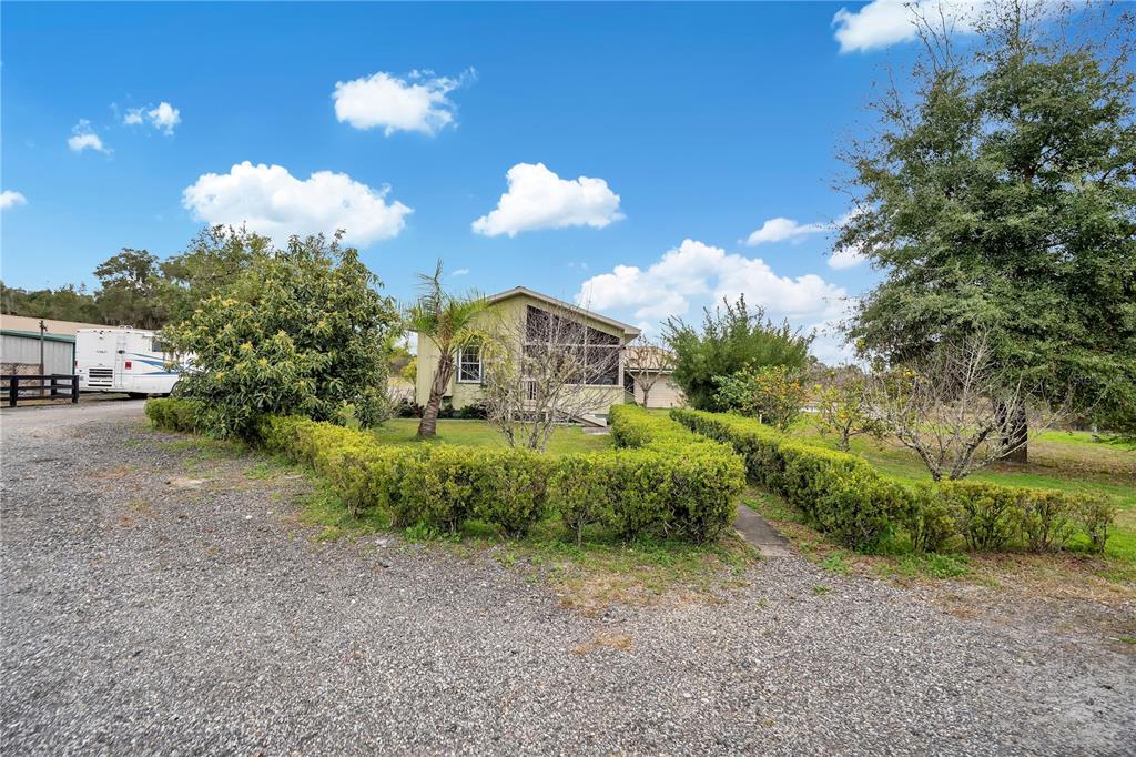 2067 Lake Juanita Road Seville, FL 32190 - Photo 40 of 96 a view of a yard in front of the house