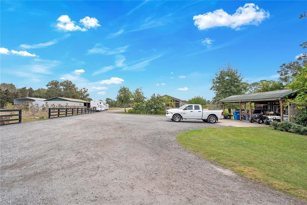 2067 Lake Juanita Road Seville, FL 32190 - Photo 42 of 96 a view of a house with a cars park