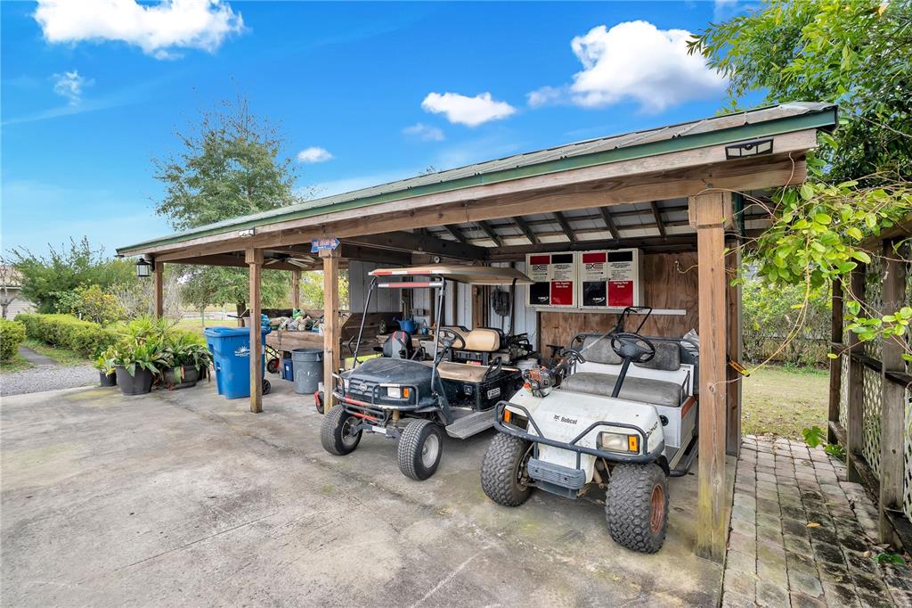 2067 Lake Juanita Road Seville, FL 32190 - Photo 43 of 96 a view of a chairs and tables in patio of the house