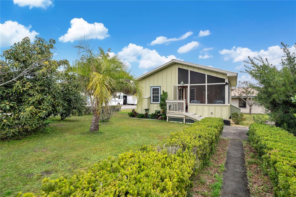 2067 Lake Juanita Road Seville, FL 32190 - Photo 44 of 96 a view of a house with a backyard
