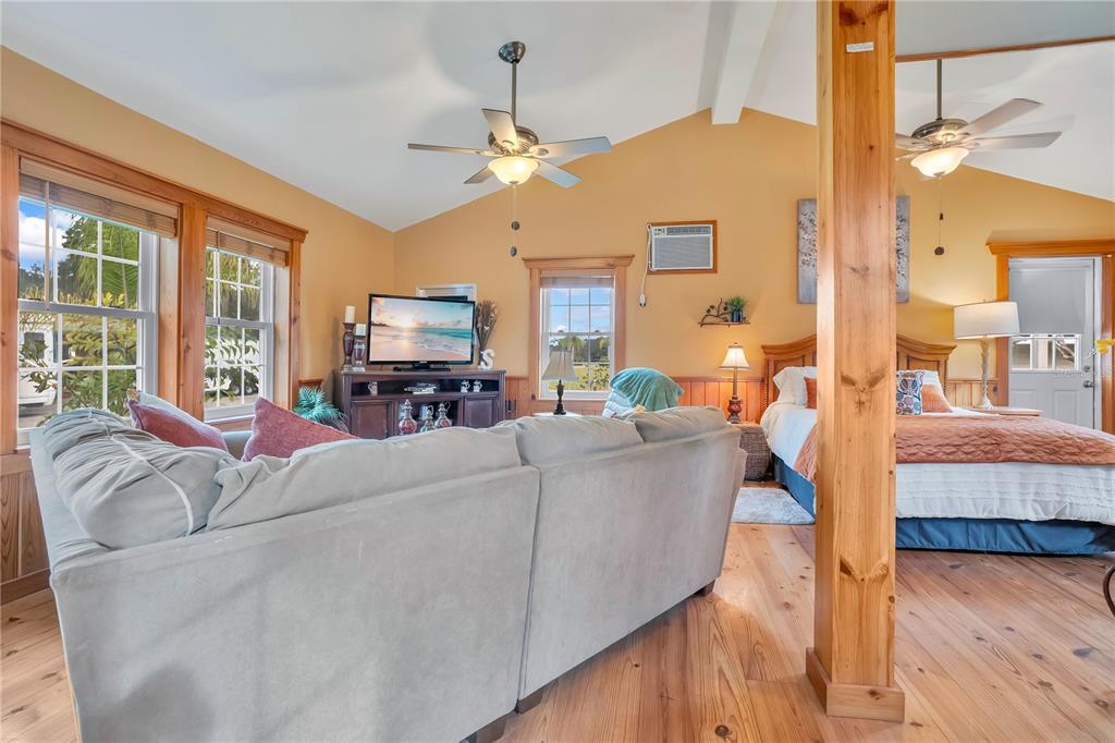 2067 Lake Juanita Road Seville, FL 32190 - Photo 48 of 96 a living room with furniture and a fireplace