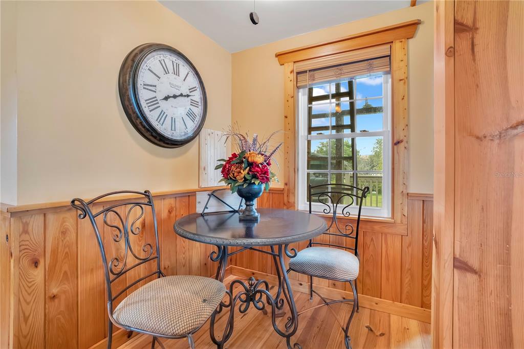 2067 Lake Juanita Road Seville, FL 32190 - Photo 53 of 96 a view of a dining room with furniture window and wooden floor