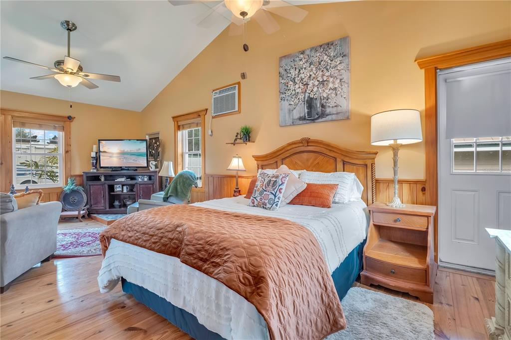 2067 Lake Juanita Road Seville, FL 32190 - Photo 54 of 96 a bedroom with a bed and wooden floor