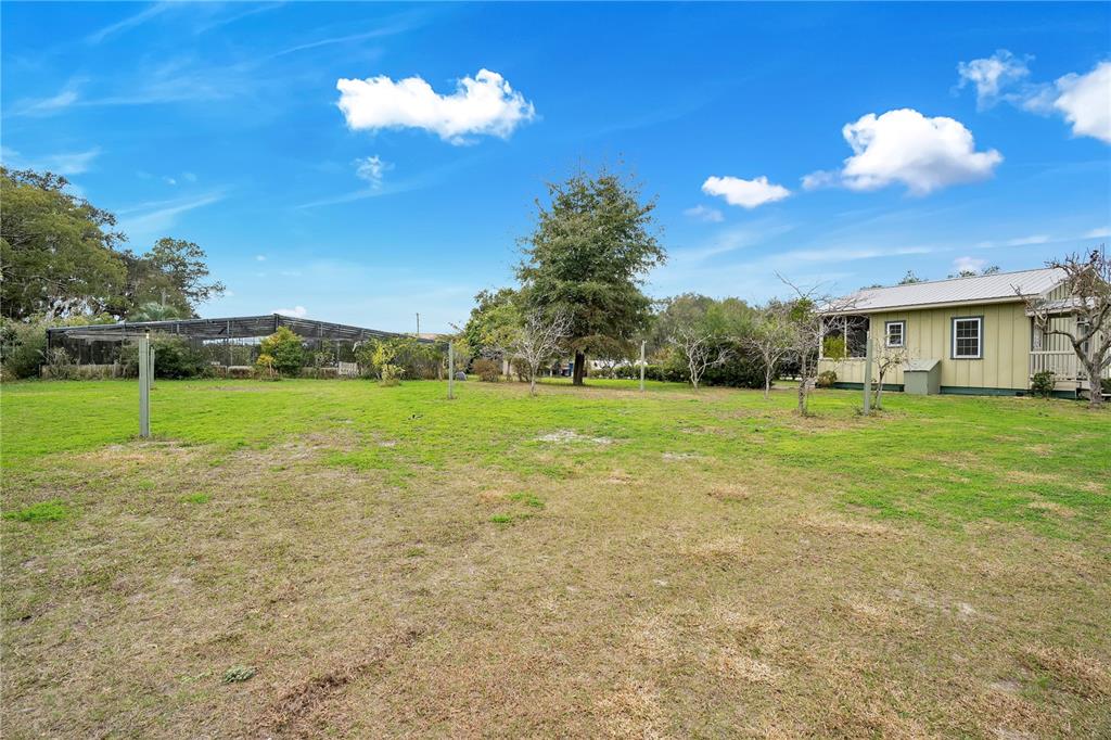 2067 Lake Juanita Road Seville, FL 32190 - Photo 64 of 96 a view of a house with a yard