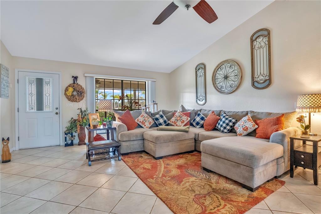 2067 Lake Juanita Road Seville, FL 32190 - Photo 7 of 96 a living room with furniture and a window