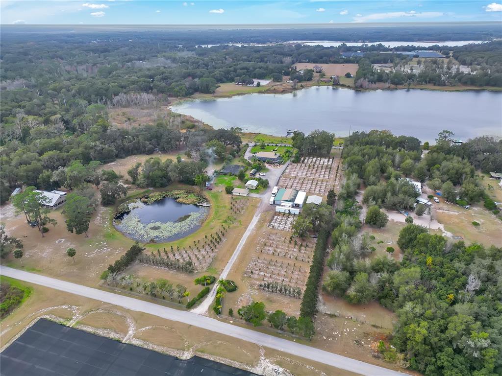 2067 Lake Juanita Road Seville, FL 32190 - Photo 83 of 96 an aerial view of residential houses with outdoor space and river
