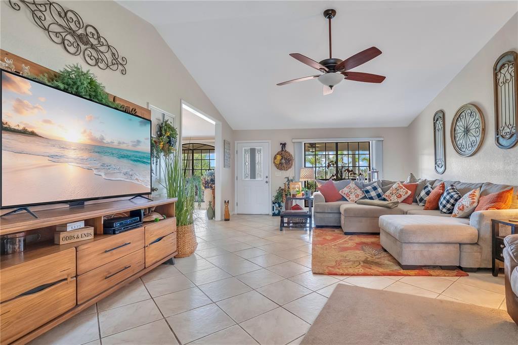 2067 Lake Juanita Road Seville, FL 32190 - Photo 10 of 96 a living room with furniture a window and a ceiling fan