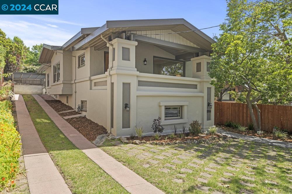 a view of a house with a small yard