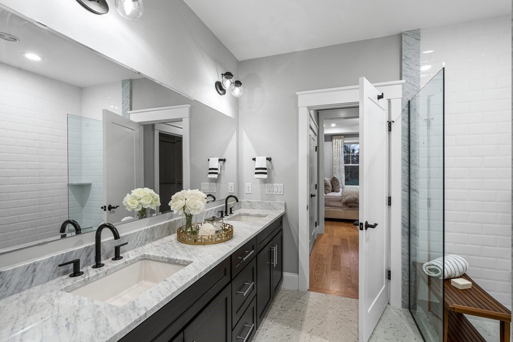 2 Pioneer Road, Unit 2 Framingham, MA 01701 - Photo 7 of 12 a bathroom with a sink double vanity and shower