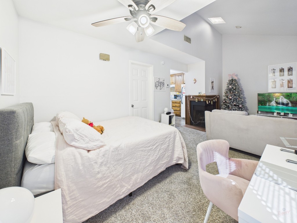 a bedroom with a bed and chandelier