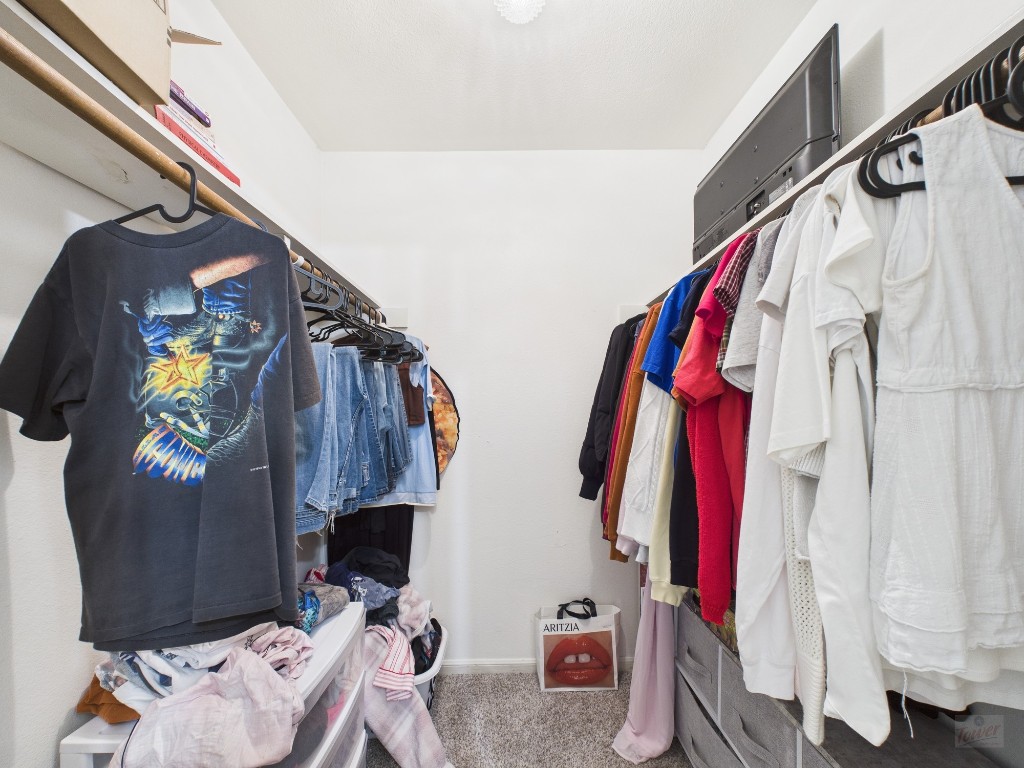 2529 Rio Grande Street, Unit 101 Austin, TX 78705 - Photo 11 of 18 a view of walk in closet with clothes and shoes