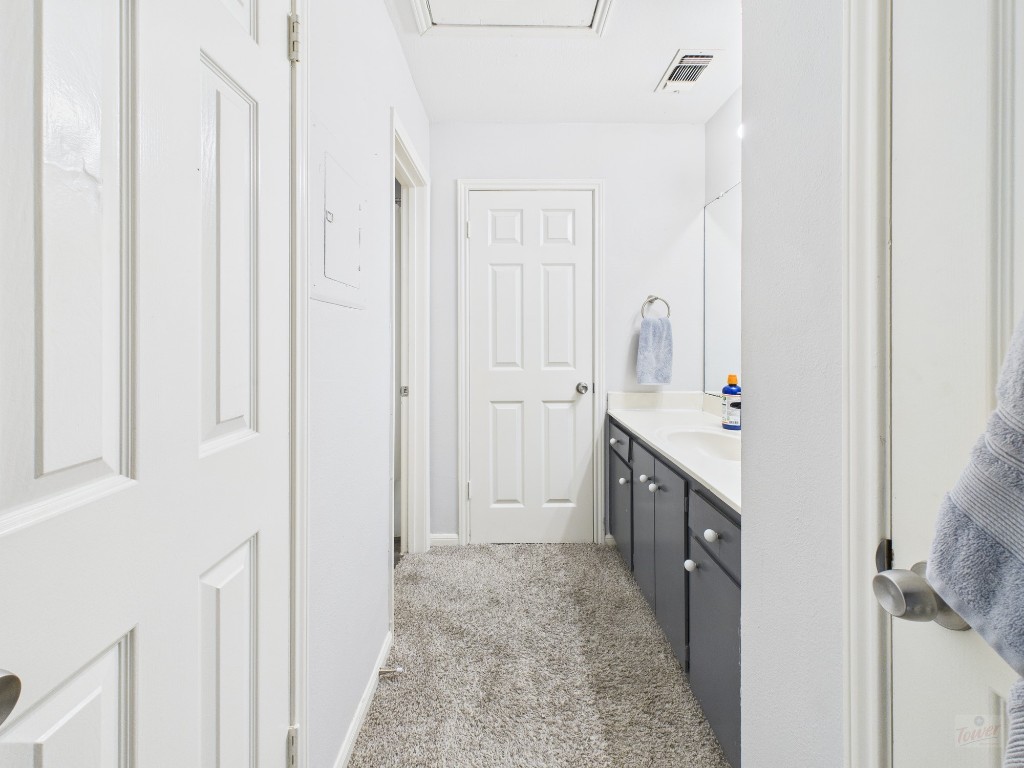 2529 Rio Grande Street, Unit 101 Austin, TX 78705 - Photo 13 of 18 a bathroom with a double vanity sink a and a shower