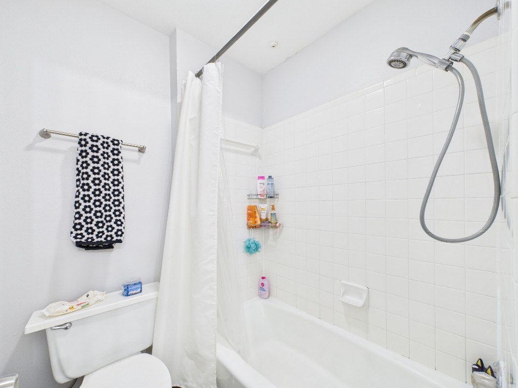 2529 Rio Grande Street, Unit 101 Austin, TX 78705 - Photo 15 of 18 a bathroom with a sink toilet and shower