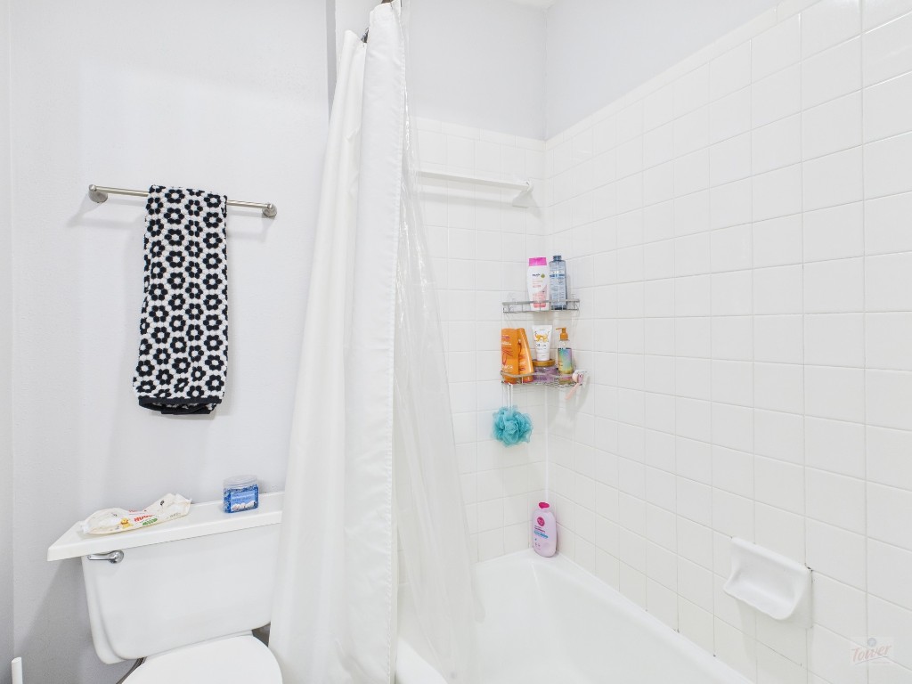 2529 Rio Grande Street, Unit 101 Austin, TX 78705 - Photo 16 of 18 a bathroom with a sink and a toilet