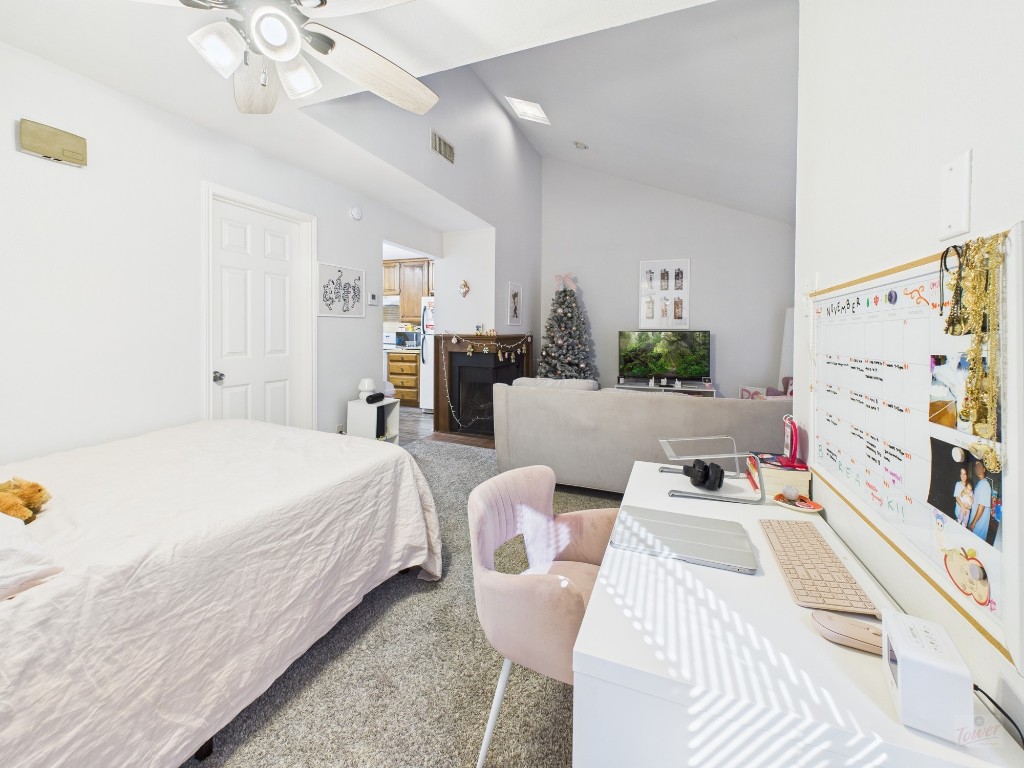 2529 Rio Grande Street, Unit 101 Austin, TX 78705 - Photo 2 of 18 a bed room with a bed and a couch