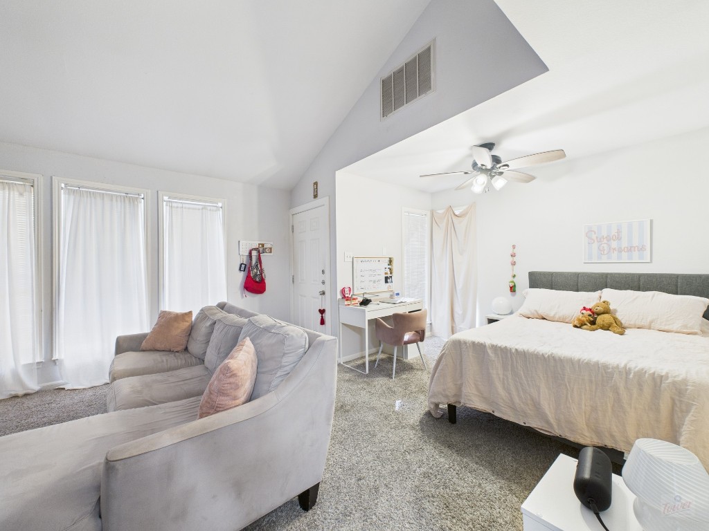 2529 Rio Grande Street, Unit 101 Austin, TX 78705 - Photo 4 of 18 a bedroom with bed and a couch