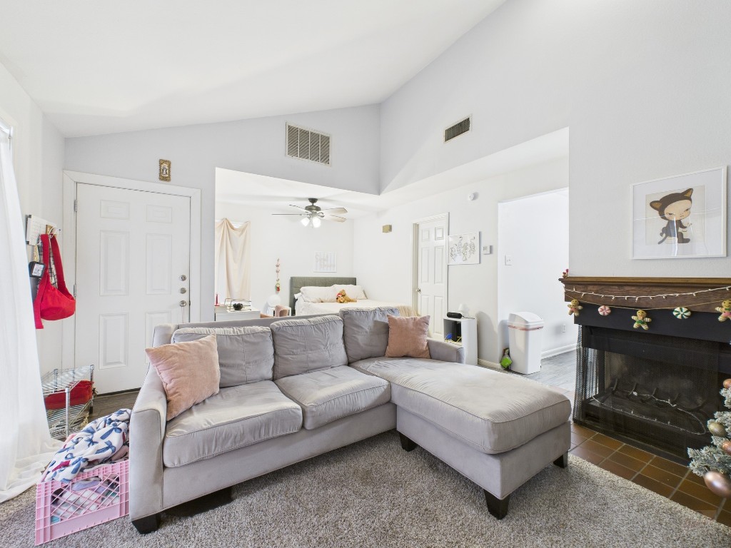 2529 Rio Grande Street, Unit 101 Austin, TX 78705 - Photo 9 of 18 a living room with furniture and a fireplace