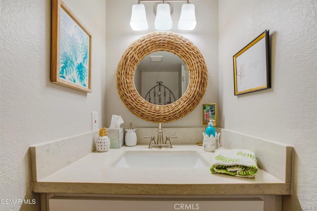 1948 Rory Lane, Unit 4 Simi Valley, CA 93063 - Photo 13 of 23 a bathroom with a sink and a mirror