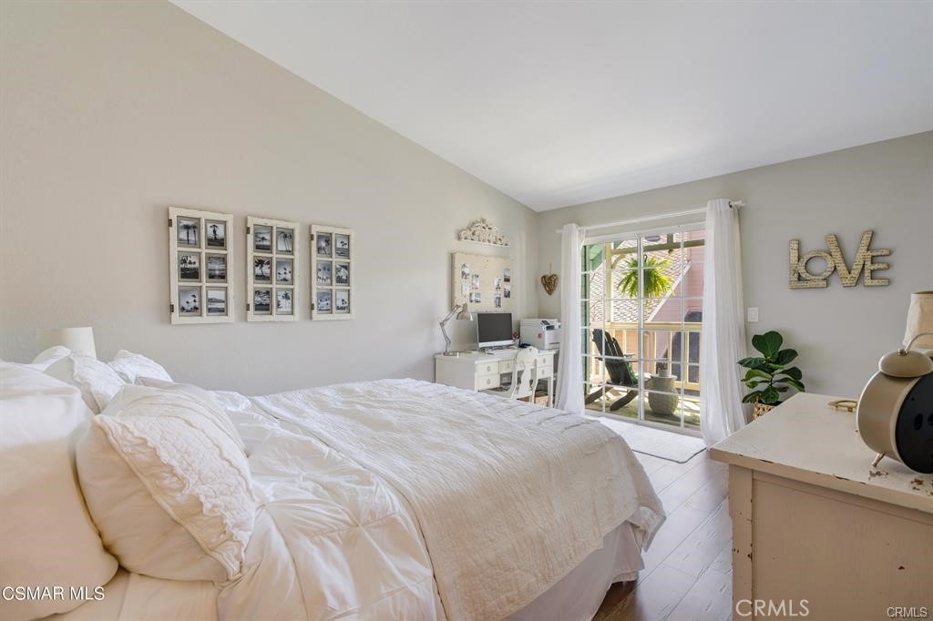 1948 Rory Lane, Unit 4 Simi Valley, CA 93063 - Photo 15 of 23 a bedroom with a bed next to a window and desk