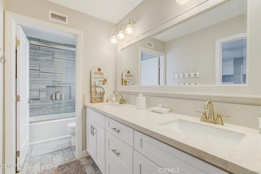 1948 Rory Lane, Unit 4 Simi Valley, CA 93063 - Photo 18 of 23 a bathroom with a sink and a mirror