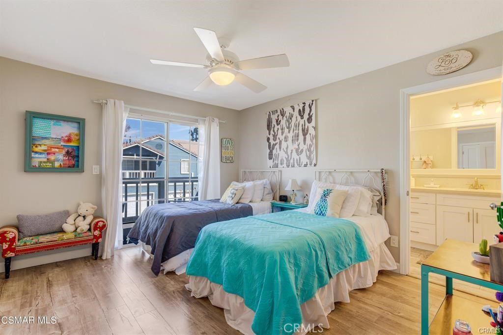 1948 Rory Lane, Unit 4 Simi Valley, CA 93063 - Photo 20 of 23 a bedroom with two beds and a large window