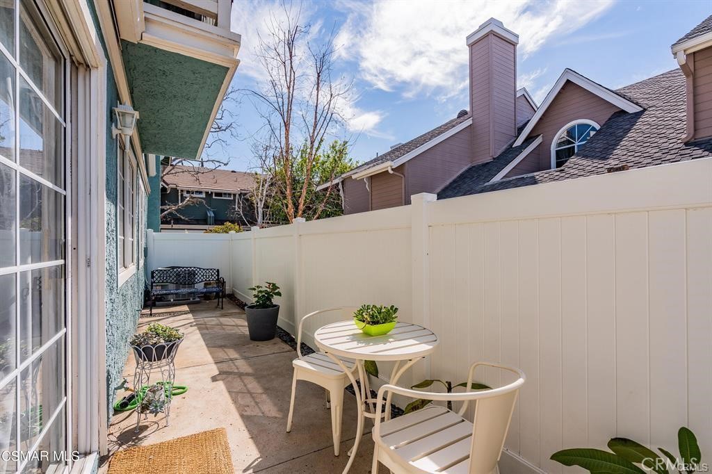 1948 Rory Lane, Unit 4 Simi Valley, CA 93063 - Photo 22 of 23 a backyard of a house with table and chairs