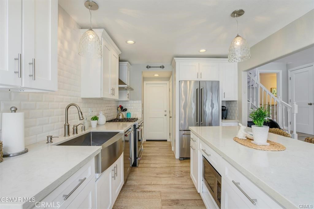 1948 Rory Lane, Unit 4 Simi Valley, CA 93063 - Photo 9 of 23 a kitchen with a sink stove and refrigerator