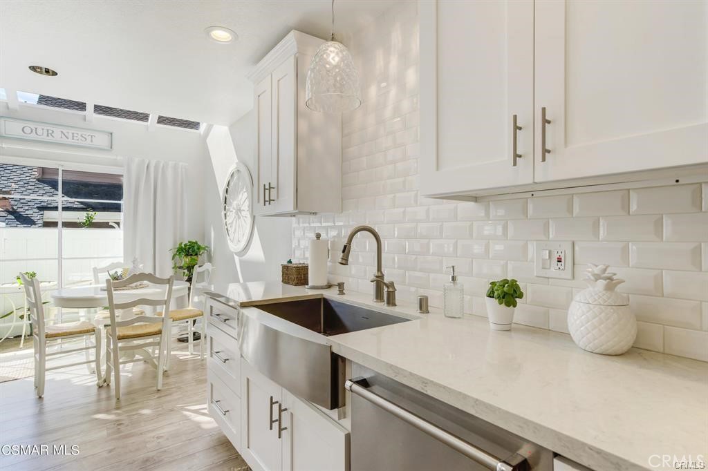 1948 Rory Lane, Unit 4 Simi Valley, CA 93063 - Photo 10 of 23 a kitchen with a white cabinets and window