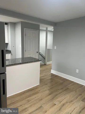 a view of a kitchen cabinets and wooden floor