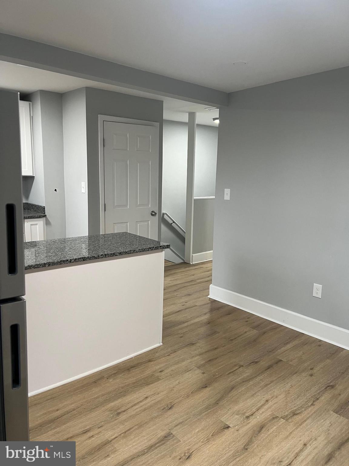 8511 Chestnut Oak Road Parkville, MD 21234 - Photo 8 of 17 a view of a kitchen cabinets and wooden floor