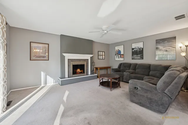 a living room with furniture and a fireplace