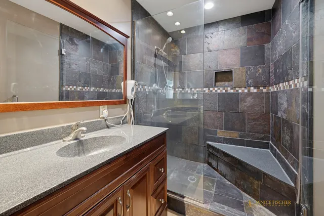 a bathroom with a sink and a mirror