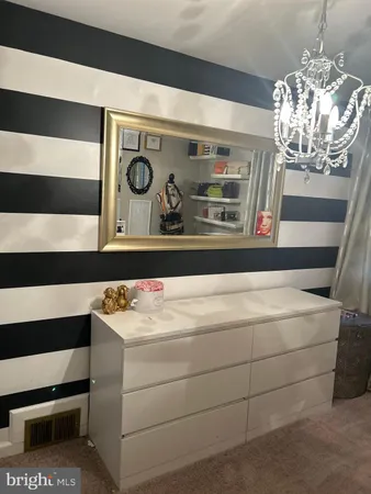 a bedroom with a bed and furniture