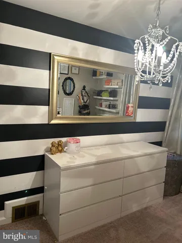 a bedroom with a bed and furniture