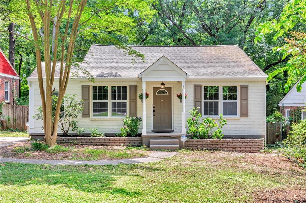 2023 Swazey Drive Decatur, GA 30032 - Photo 1 of 1 a front view of a house with a yard and potted plants