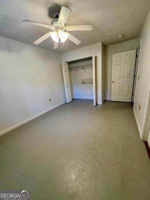 983 Johnny Brannen Road Statesboro, GA 30458 - Photo 17 of 27 an empty room with a ceiling fan and closet area