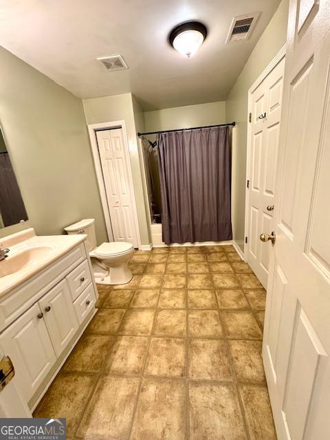 983 Johnny Brannen Road Statesboro, GA 30458 - Photo 18 of 27 a bathroom with a double vanity sink and a mirror